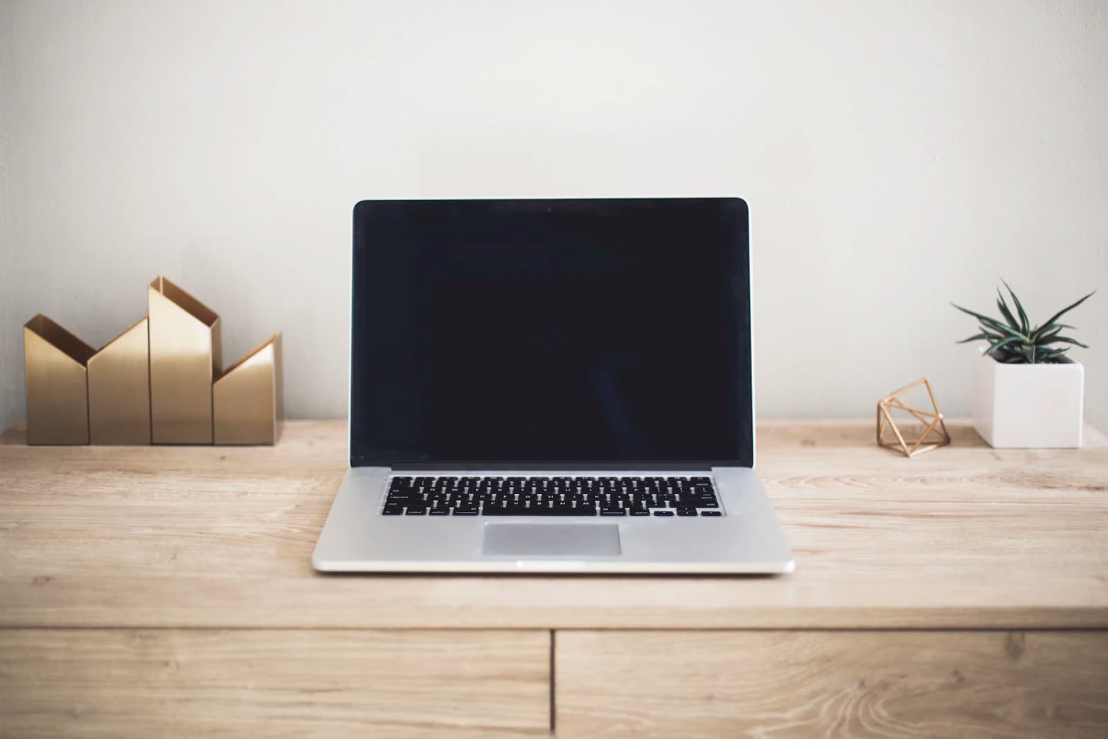Freelancer working on a laptop reviewing financial and tax information